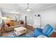 Cozy living room with hardwood floors, decorative ceiling, and open floorplan at 419 W Osborne Ave, Tampa, FL 33603