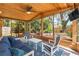 Relaxing porch area with wood ceiling and view of the fenced-in back yard at 419 W Osborne Ave, Tampa, FL 33603