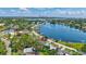 Aerial view showcasing a waterfront home with mature trees, lush greenery, and a beautiful waterfront at 4321 Sunrise S Dr, St Petersburg, FL 33705