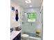 Bright bathroom with modern shower, glass door, and stylish vanity at 4321 Sunrise S Dr, St Petersburg, FL 33705