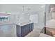 New kitchen with a blue island, modern appliances, and stylish pendant lights at 4321 Sunrise S Dr, St Petersburg, FL 33705