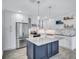 Modern kitchen features stainless steel appliances, marble countertops, and a large island at 4321 Sunrise S Dr, St Petersburg, FL 33705