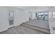 Bright and airy living room featuring water views and luxury vinyl plank flooring at 4321 Sunrise S Dr, St Petersburg, FL 33705