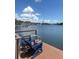 Relaxing waterfront deck with seating, perfect for enjoying the serene views and sunny weather at 4321 Sunrise S Dr, St Petersburg, FL 33705