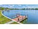 Waterfront view featuring a private wooden dock with views of the bay and skyline at 4321 Sunrise S Dr, St Petersburg, FL 33705