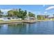 Waterfront homes along a canal feature a private dock and lush landscaping at 4321 Sunrise S Dr, St Petersburg, FL 33705