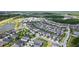 Aerial view of a Primary planned community with single Gathering homes, parks, ponds and schools at 4345 Cadence Loop, Land O Lakes, FL 34638