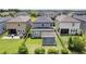 Well-maintained backyard with a covered patio and lush green lawn, perfect for outdoor enjoyment at 4345 Cadence Loop, Land O Lakes, FL 34638