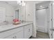 Bathroom features a double sink vanity, quartz countertops, and natural lighting at 4345 Cadence Loop, Land O Lakes, FL 34638
