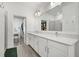 Spacious bathroom with double sink vanity, quartz countertops, and large mirror at 4345 Cadence Loop, Land O Lakes, FL 34638