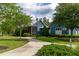 Community game room and swim club building with a sidewalk and landscaping at 4345 Cadence Loop, Land O Lakes, FL 34638