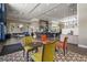 Inviting restaurant with bar seating and tables, and floral decorations at 4345 Cadence Loop, Land O Lakes, FL 34638