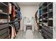 Custom walk-in closet with built-in shelving and dressing area at 4345 Cadence Loop, Land O Lakes, FL 34638