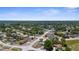 Picturesque aerial of a quiet neighborhood featuring tree-lined streets and inviting homes at 4499 Collins Rd, Spring Hill, FL 34606