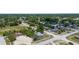 Expansive aerial view of a residential neighborhood with mature trees and well-maintained homes at 4499 Collins Rd, Spring Hill, FL 34606