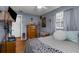 This cozy bedroom is decorated with stylish decor and a comfortable looking bed with a fun leopard throw blanket at 4499 Collins Rd, Spring Hill, FL 34606