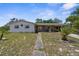 Charming single-story home with a classic facade and a well-maintained front yard at 4499 Collins Rd, Spring Hill, FL 34606