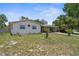 Quaint home with a simple, well-cared for front yard and ample parking space at 4499 Collins Rd, Spring Hill, FL 34606