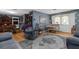 Inviting living room offers hardwood floors, an accent wall, and bright natural light at 4499 Collins Rd, Spring Hill, FL 34606