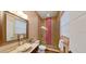 This powder room features a stone vessel sink and an elegant glass shower at 4962 Turtle Creek Trl, Oldsmar, FL 34677
