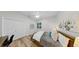 Comfortable bedroom featuring hardwood floors, ceiling fan, and natural light at 4962 Turtle Creek Trl, Oldsmar, FL 34677