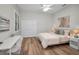 This is a cozy bedroom with hard wood flooring and bright natural light at 4962 Turtle Creek Trl, Oldsmar, FL 34677