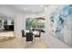 Bright breakfast nook adjacent to a patio with black chairs and a table at 4962 Turtle Creek Trl, Oldsmar, FL 34677