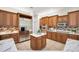 Beautiful kitchen featuring stainless steel appliances, custom cabinets, and marble countertops at 4962 Turtle Creek Trl, Oldsmar, FL 34677