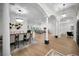 Large living area with open floor plan and beautiful hardwood floors, open to dining area and adjacent living spaces at 4962 Turtle Creek Trl, Oldsmar, FL 34677
