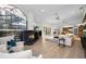 Open-concept living room features an inviting fireplace, ample natural light, and a seamless flow to the kitchen at 4962 Turtle Creek Trl, Oldsmar, FL 34677