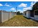 Spacious backyard featuring white vinyl fencing and a grassy lawn at 5053 Lofton Dr, New Port Richey, FL 34652