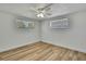 The bright room has new floors, ceiling fan, and two windows at 5053 Lofton Dr, New Port Richey, FL 34652
