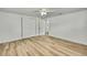 Light-filled bedroom features new flooring and closet at 5053 Lofton Dr, New Port Richey, FL 34652