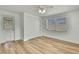 Bedroom featuring light wood flooring, a closet, a window, and an exterior door at 5053 Lofton Dr, New Port Richey, FL 34652