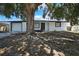 Charming single-story home featuring a white exterior, well-maintained garage, and inviting front porch at 5053 Lofton Dr, New Port Richey, FL 34652