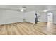 Spacious living room with light wood floors and great natural lighting at 5053 Lofton Dr, New Port Richey, FL 34652