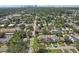 Wide aerial shot of the property's location within a lush, green residential area near the city at 510 33Rd N Ave, St Petersburg, FL 33704