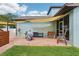 Backyard with paved patio, grill area, shade sails, and inviting outdoor seating at 510 33Rd N Ave, St Petersburg, FL 33704