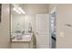Bathroom featuring granite vanity and a doorway to an adjoining room at 510 33Rd N Ave, St Petersburg, FL 33704