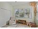 Cozy bedroom offers natural light, a large window, neutral tones and a closet at 510 33Rd N Ave, St Petersburg, FL 33704