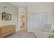 Neutral Bedroom features a closet, dresser and a comfortable recliner at 510 33Rd N Ave, St Petersburg, FL 33704
