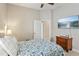 Inviting bedroom featuring wall-mounted TV and doorway to adjoining room at 510 33Rd N Ave, St Petersburg, FL 33704