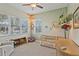 Bright bedroom with ceiling fan, neutral tones, plush carpet and a large window at 510 33Rd N Ave, St Petersburg, FL 33704