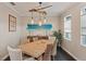 Cozy dining room featuring modern light fixtures and unique wall decorations at 510 33Rd N Ave, St Petersburg, FL 33704