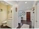 Inviting entryway featuring hardwood floors, a charming half bath, and warm, neutral paint tones at 510 33Rd N Ave, St Petersburg, FL 33704