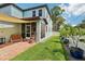 View of the home's exterior highlighting backyard, patio, landscaping, and architectural details at 510 33Rd N Ave, St Petersburg, FL 33704