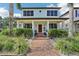 Inviting two-story home with a brick walkway and lush landscaping enhancing curb appeal at 510 33Rd N Ave, St Petersburg, FL 33704