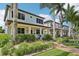 Stylish two-story home with a well-manicured lawn, lush landscaping, and inviting curb appeal at 510 33Rd N Ave, St Petersburg, FL 33704