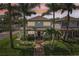 Charming two-story home featuring manicured landscaping, fenced yard and mature palms at 510 33Rd N Ave, St Petersburg, FL 33704