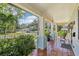 Charming front porch with tiled floor, columns, and space for relaxing with neighborhood views at 510 33Rd N Ave, St Petersburg, FL 33704